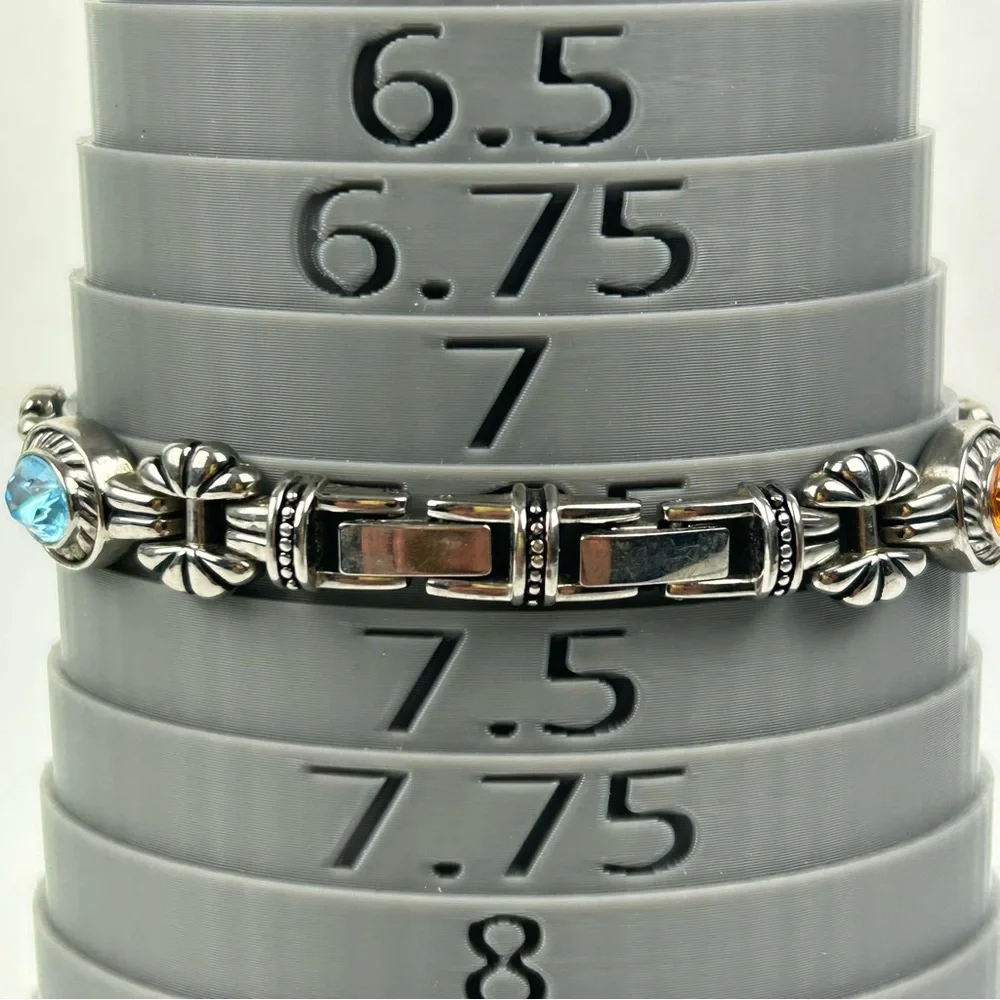 Elegant Silver Tone Quartz watch with Pink, Green, Gold and Blue Accents